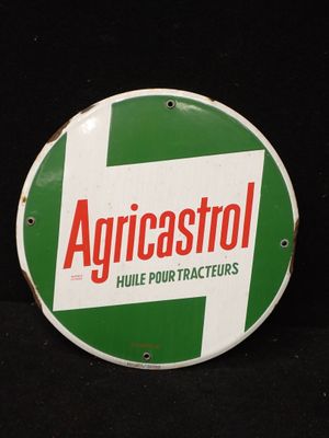 un panneau vert et blanc sur lequel est inscrit « Agricostol »