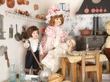 a lot of dolls that are sitting in a room