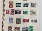 a notebook with a lot of different stamps on it
