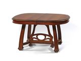 une table à manger ovale avec deux rallonges en haut et deux rallonges en bas