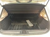 a trunk of a car with a remote control in it
