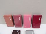 several different colors of cell phones are lined up on a table