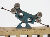 a metal sculpture of a bird on top of a fence