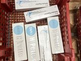 boxes of toothpaste and toothpaste are in a red basket