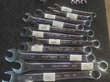 a lot of wrenches that are sitting on a table