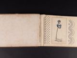 an open book with a drawing of a woman in a blue dress