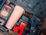 a blue tool case with tools in it on a table
