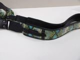 a snake skin belt with a black buckle on it