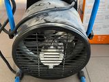 a fan that is sitting on top of a table