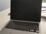 a laptop computer sitting on top of a wooden desk