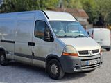 a silver van that is parked in a parking lot