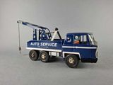 a toy truck with a crane on the back of it