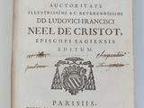 un livre ouvert sur lequel figure l'image d'un blason et un blason