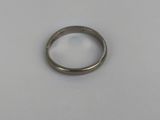 a close up of a silver ring on a white surface