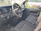 a view of the inside of a car from the driver ' s seat