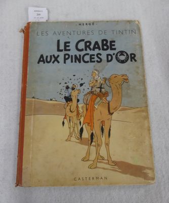 an old book with a picture of a man riding a camel