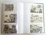 an open book with pictures of buildings on it