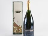 a bottle of champagne in front of a box of wine