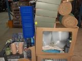 a pile of boxes and other items in a warehouse