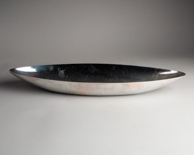 a close up of a bowl on a white surface