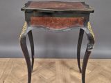 an image of a small table with a drawer on top of it