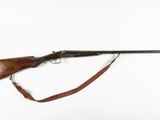 a rifle on a white background with a red strap