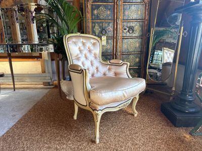 a chair that is sitting in the middle of a room