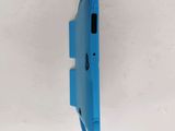 a close up of the back of a blue cell phone on a white surface