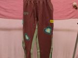 a pair of pants hanging on a rack in a room