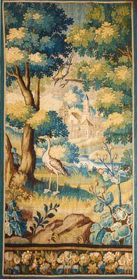 a tapestry hanging on the wall of a room