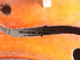 an image of a close up of a violin with a label on it