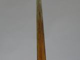 a small sailboat that is sitting on a wooden stand