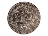 une pièce d'argent sur laquelle figure l'image d'un homme à cheval