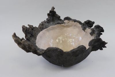 a small bowl that has some sort of decoration on it