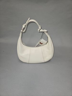 white purse on grey background with white strap and handle