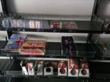 a lot of makeup products on the shelves in the room