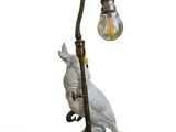 a lamp that has a bird on top of it