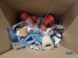 a cardboard box filled with assorted items and a roll of tape