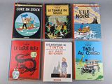 six children ' s books are lined up in a row on a table