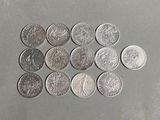 a lot of coins that are on the table