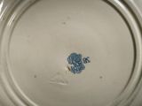 a close up of a plate with a blue and white design on it