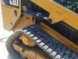 a picture of a yellow cat ski - door parked in a parking lot