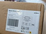 a cardboard box with a sticker on it sitting on a table