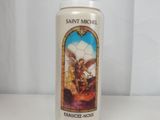 candle with saint michael on it sitting on a white table