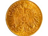 l'image d'une pièce d'or ornée d'un aigle