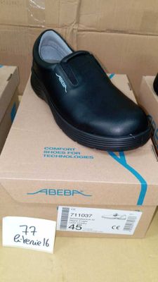 a box with a pair of black shoes on top of it
