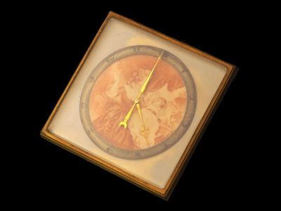 a picture of a clock with a picture of a woman on it