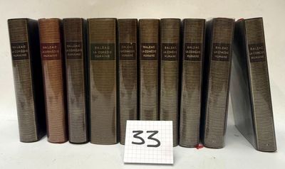 five books are lined up in a row on a white surface