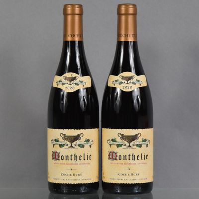 two bottles of wine sitting on top of a table
