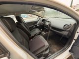 the interior of a car with the door open showing the driver ' s seat area